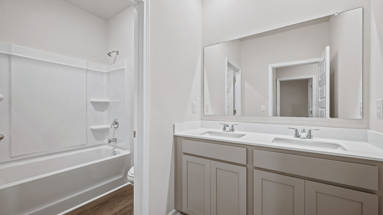 bathroom with dual sinks