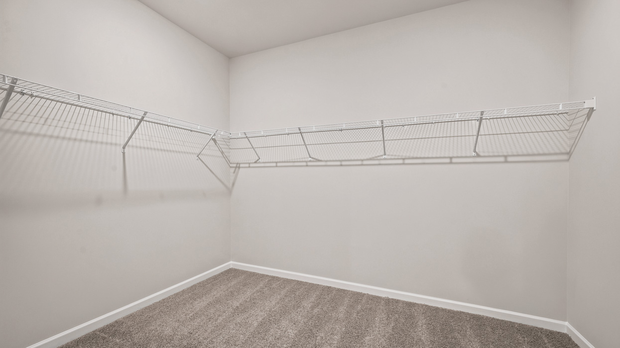 primary bathroom with walk-in closet