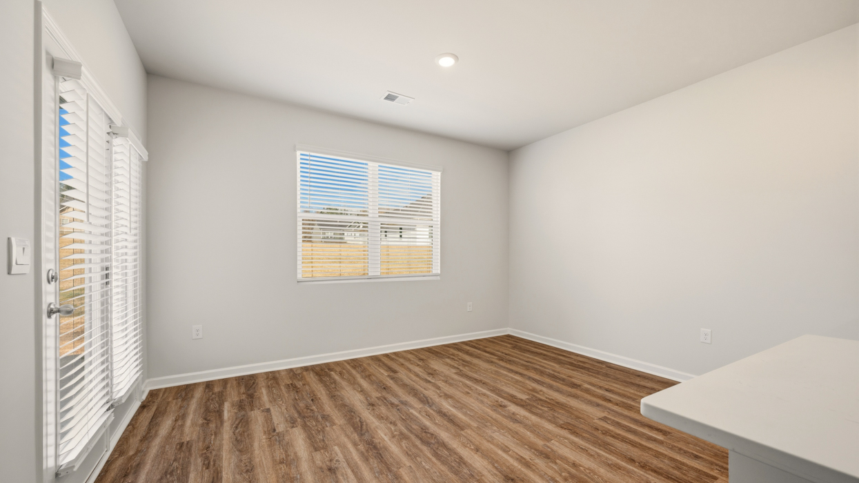 dining room with natural lighting and covered back patio access