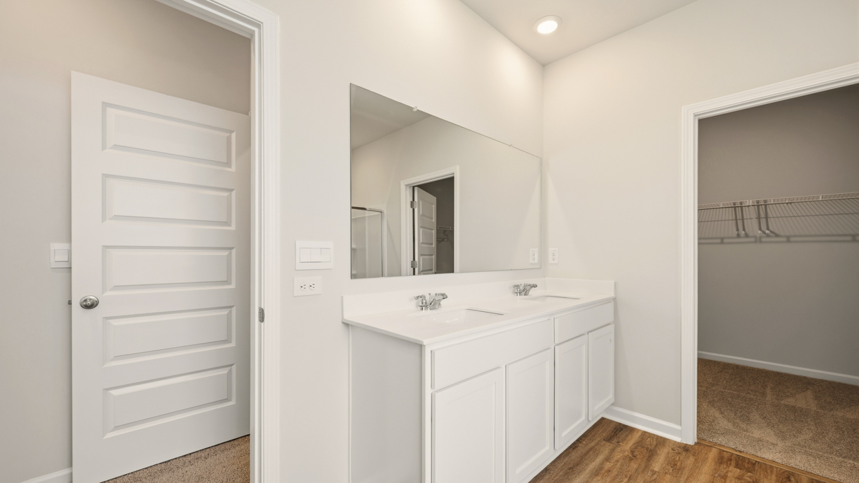 primary bathroom with dual sinks