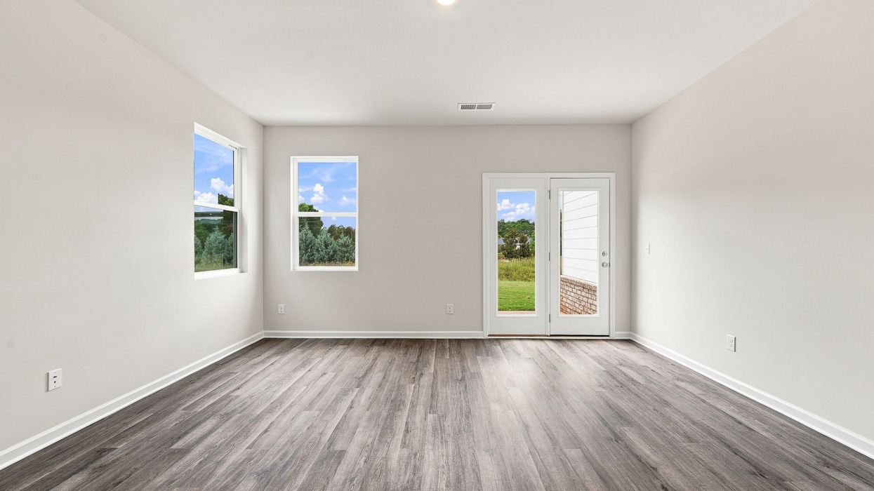 living room with abundance of natural light and access to back patio