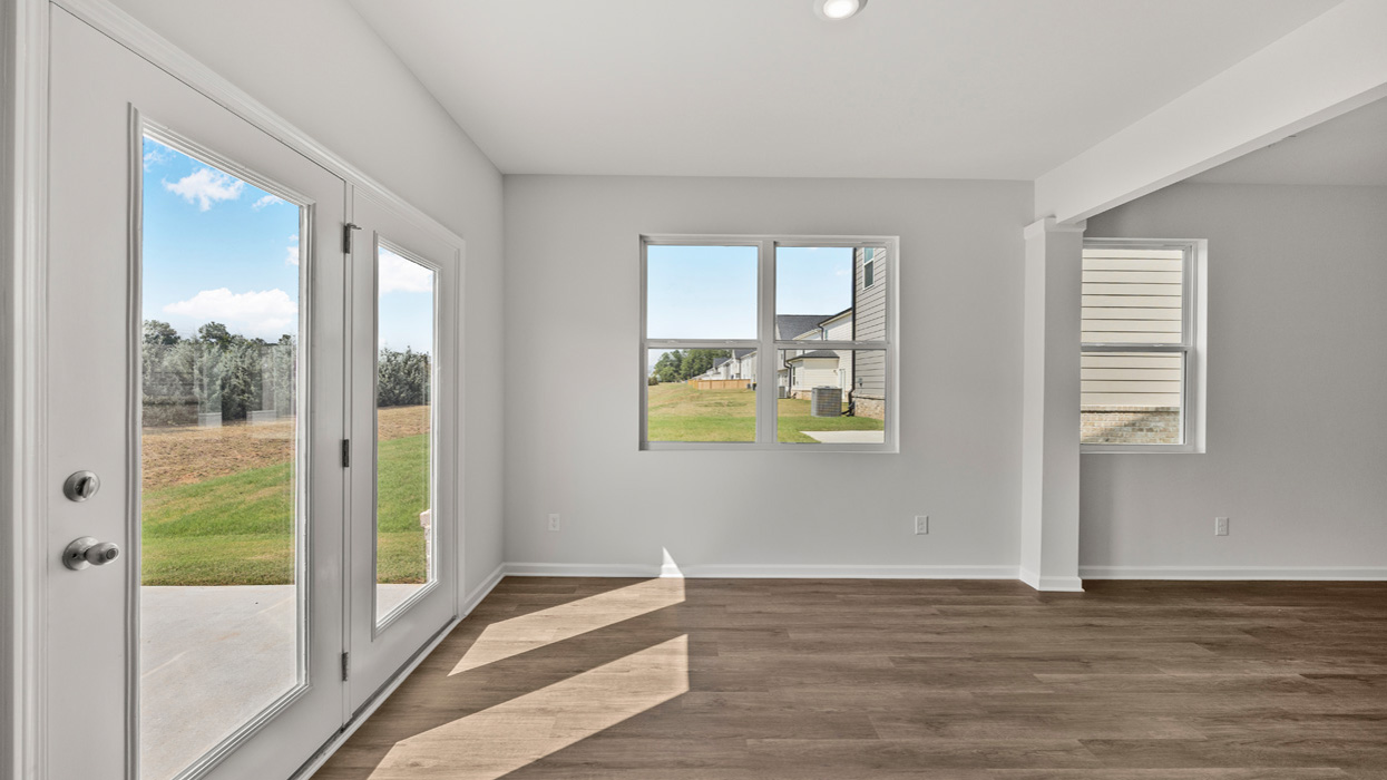 angled breakfast room with rear patio access