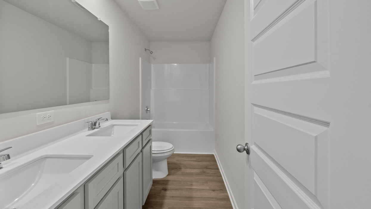 bathroom with dual sinks