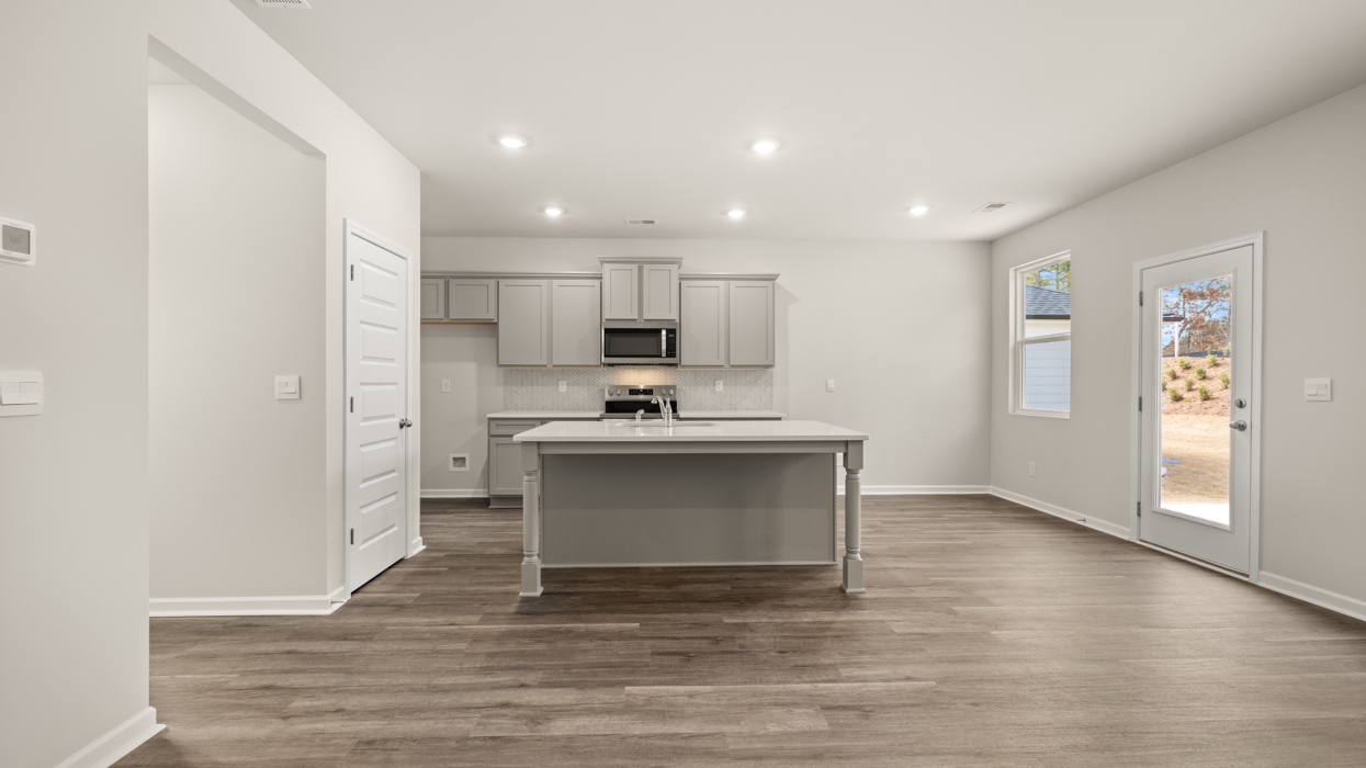 kitchen with large center island and spacious gray cabinetry