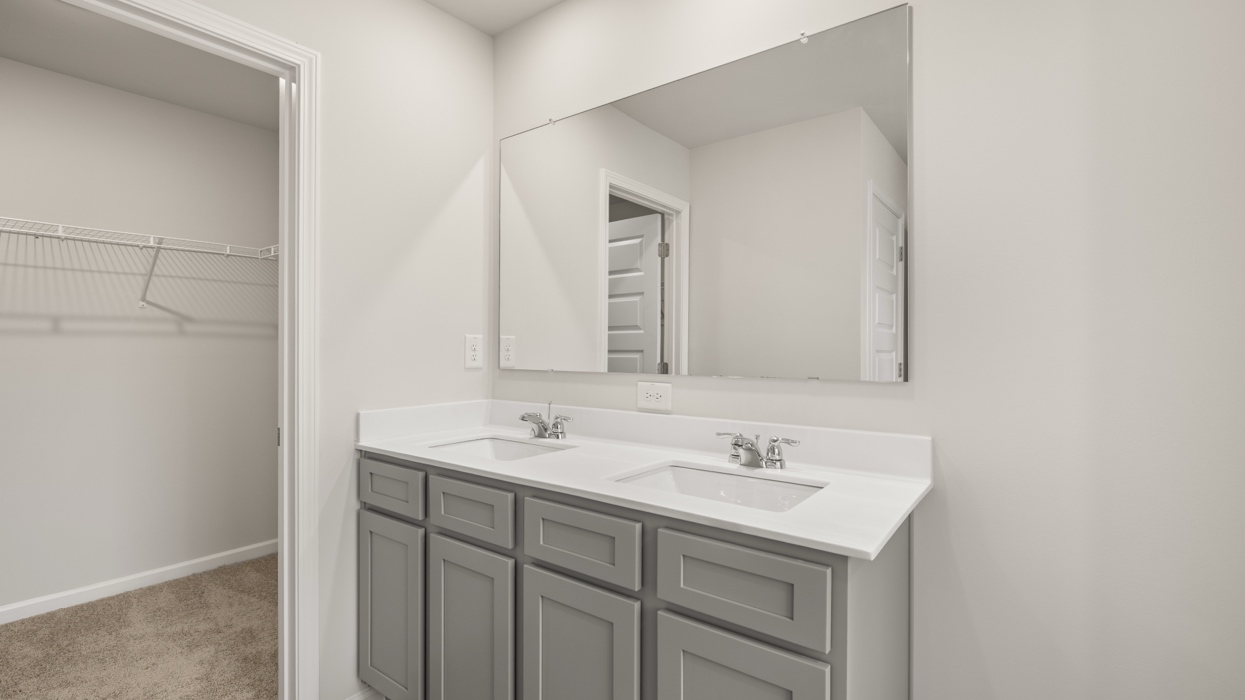 primary bathroom with dual sinks