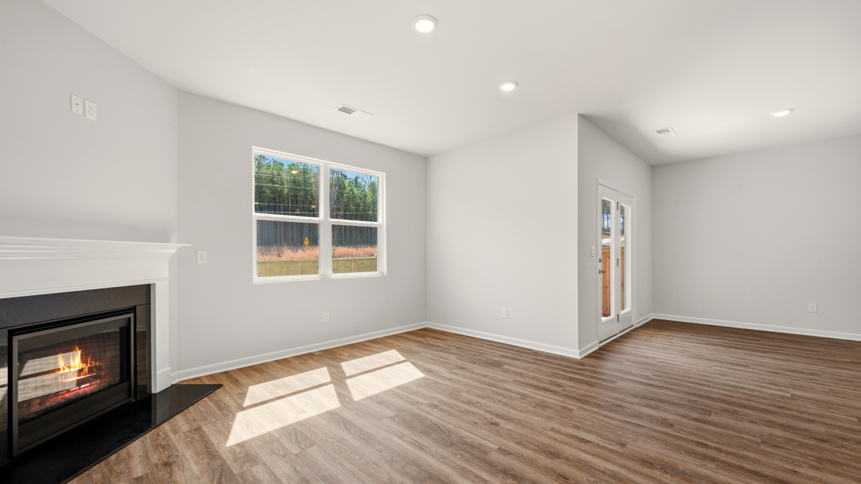 living room and breakfast room with natural light