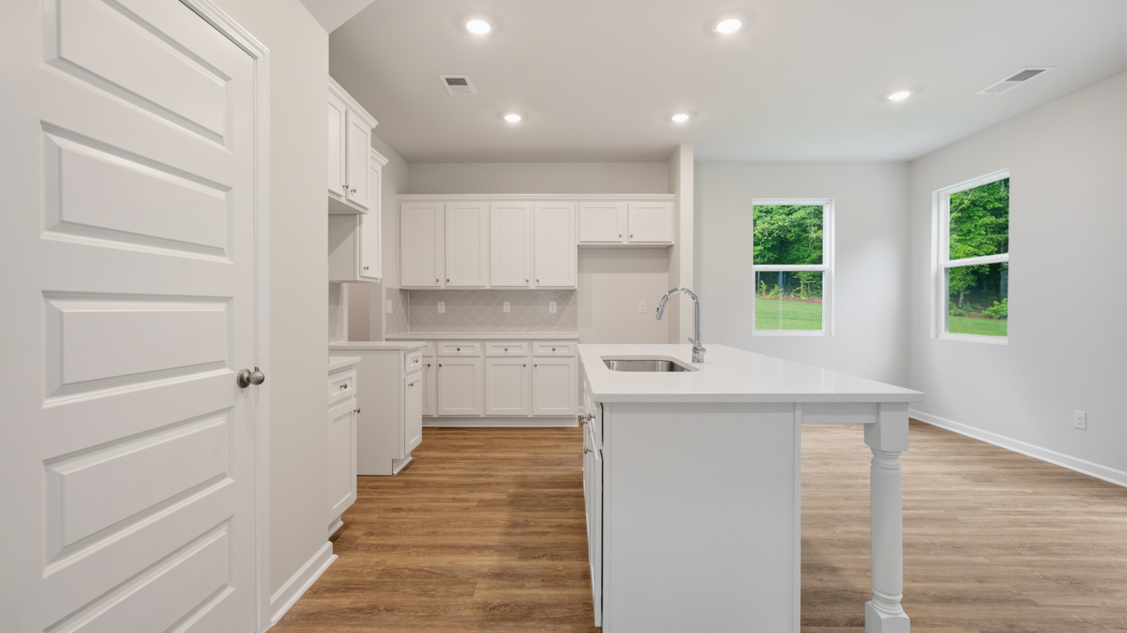 kitchen with spacious white cabinetry and large center island