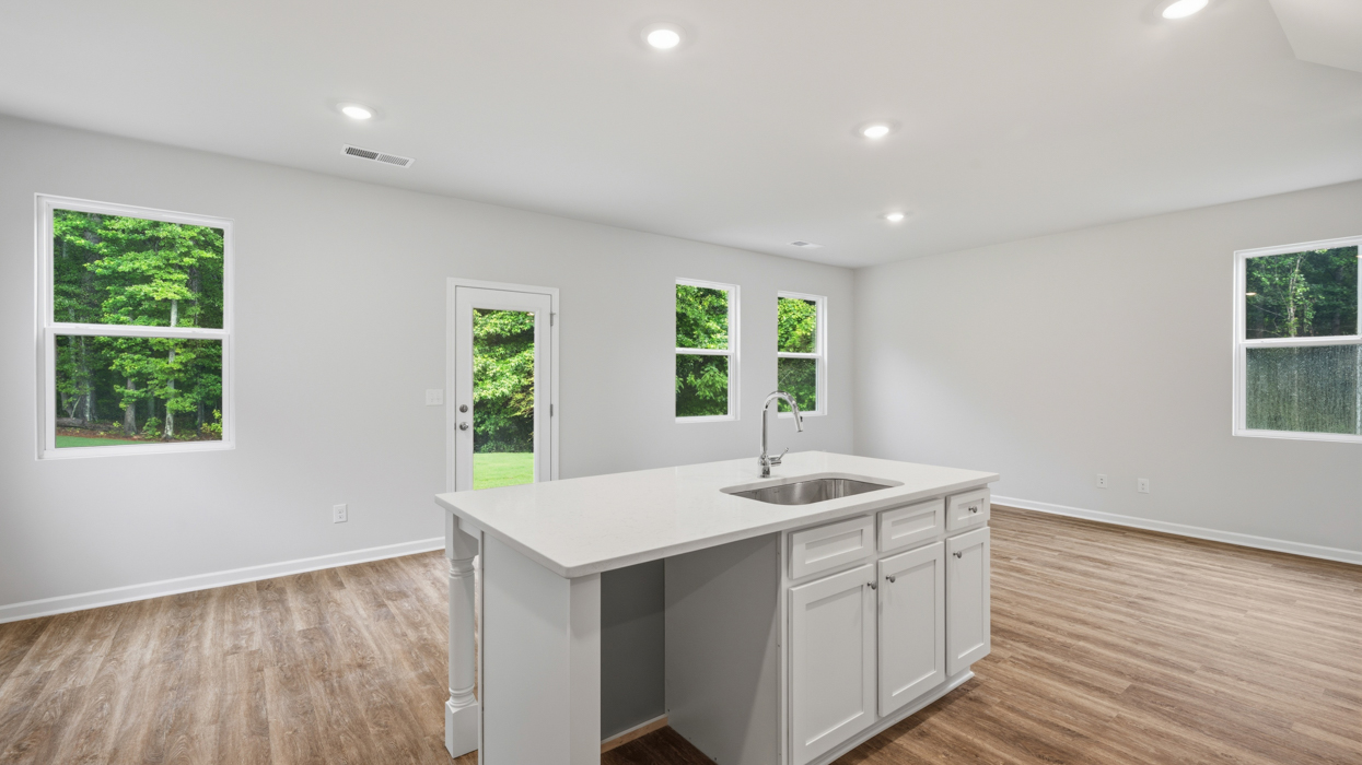 kitchen and living room with abundance of natural light