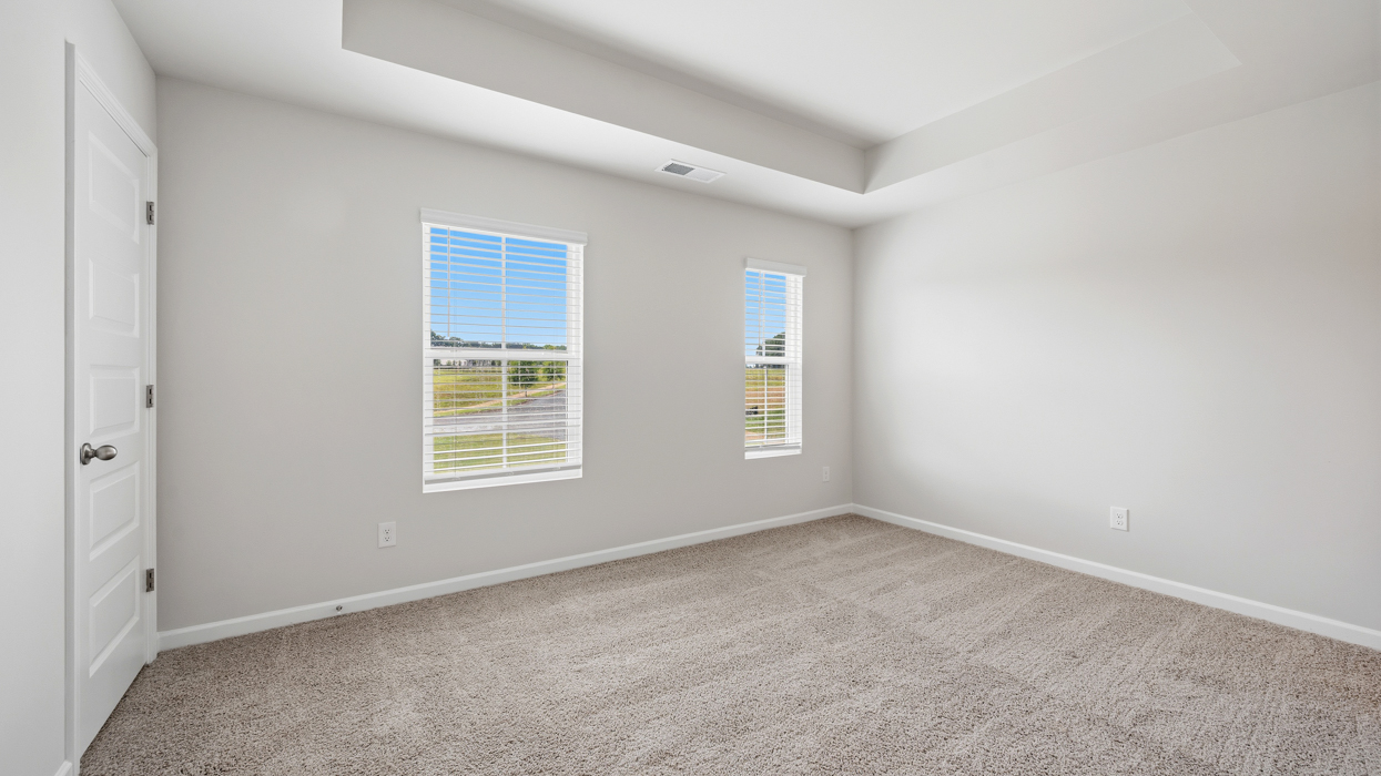 primary bedroom with abundance of natural light