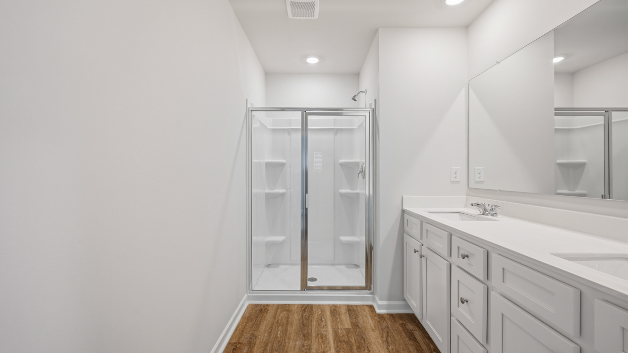 primary bathroom with dual sinks