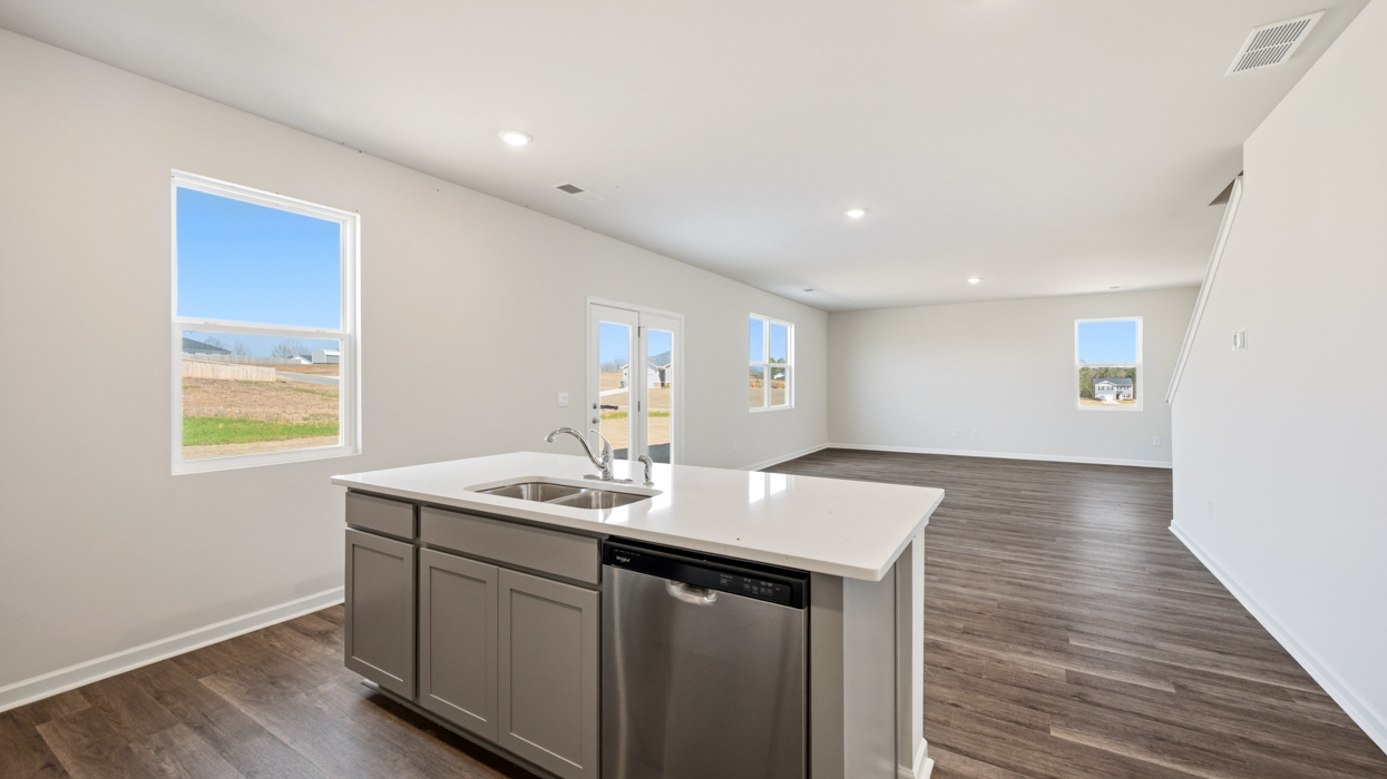 Kitchen with Island sink and dishwasher