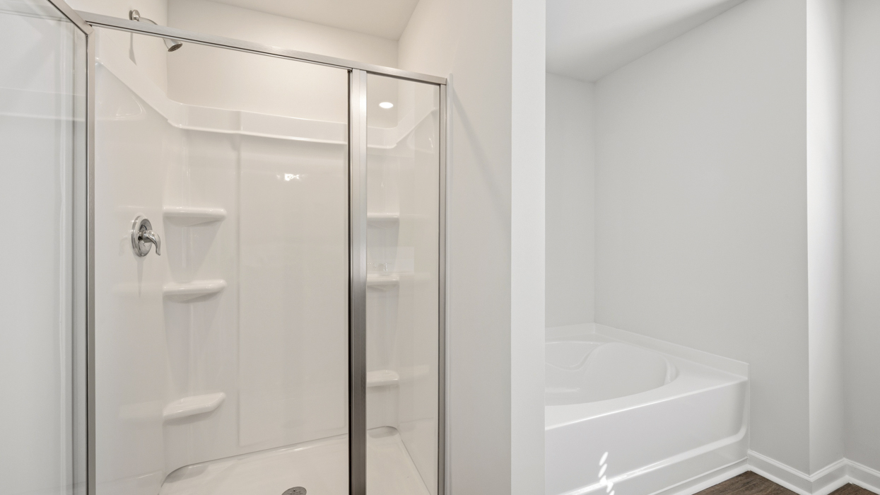 Bedroom 1 bathroom with walk in shower and soaking tub