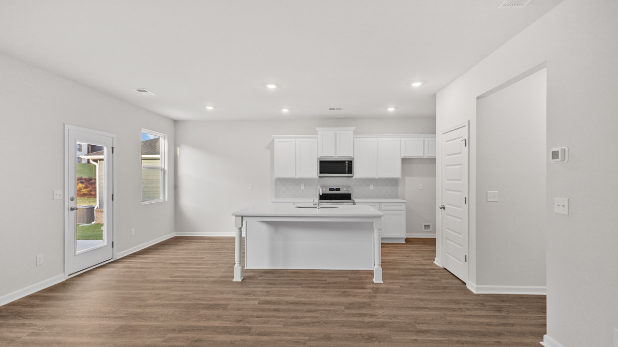 Kitchen with white cabinets and center island