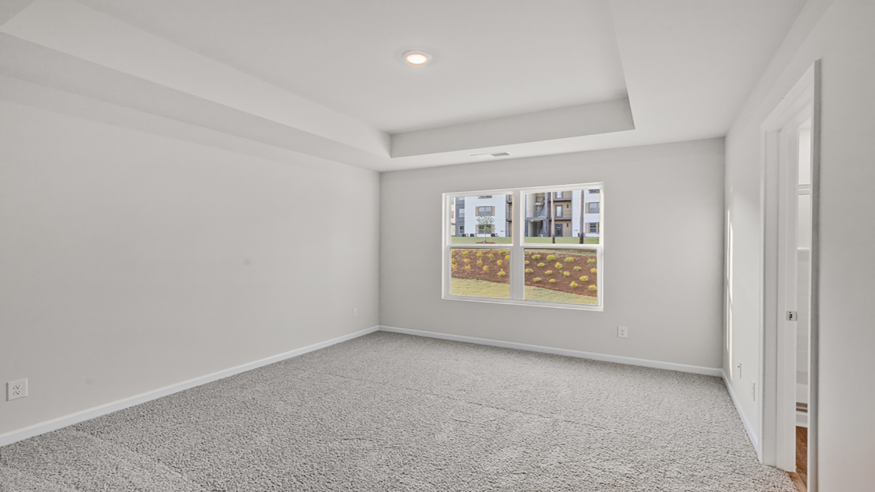 bedroom 1 with tray ceiling