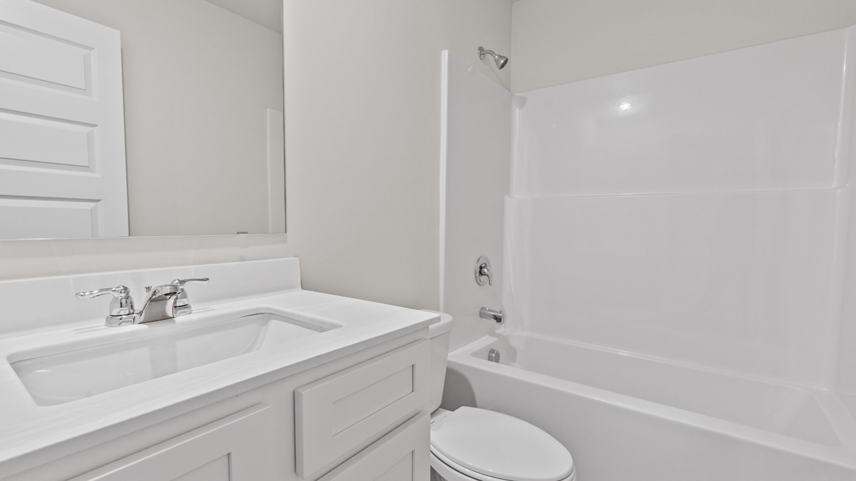 hall bathroom with tub shower