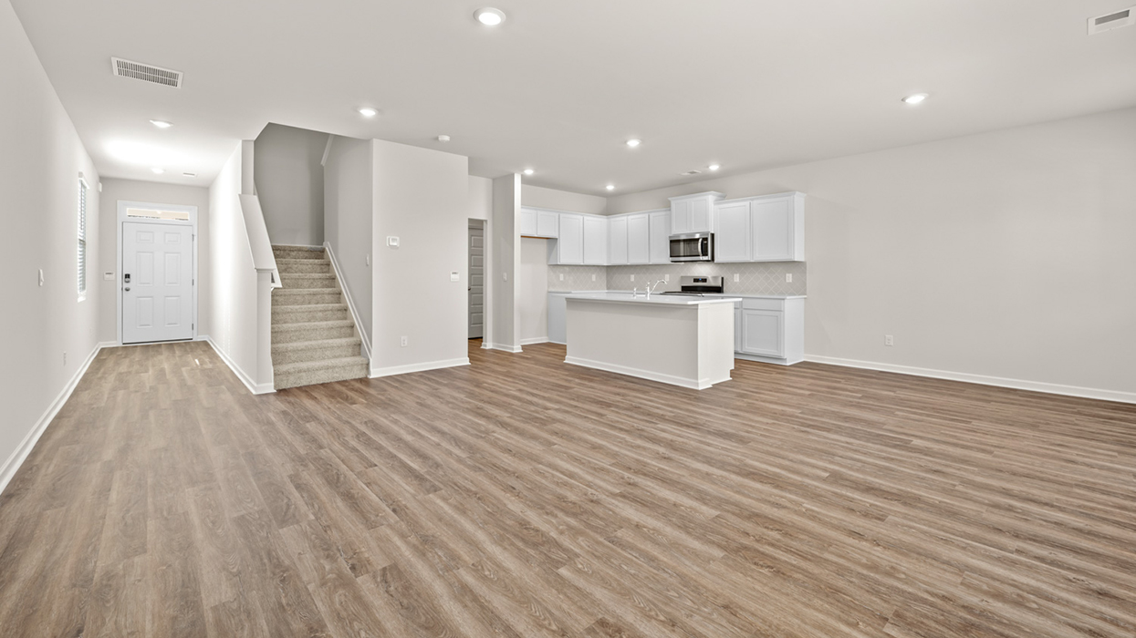 living area open to hallway and kitchen