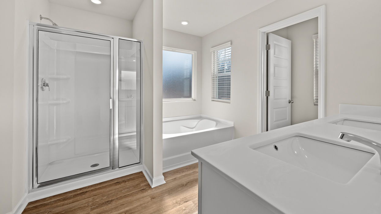 primary bathroom eith tub and shower