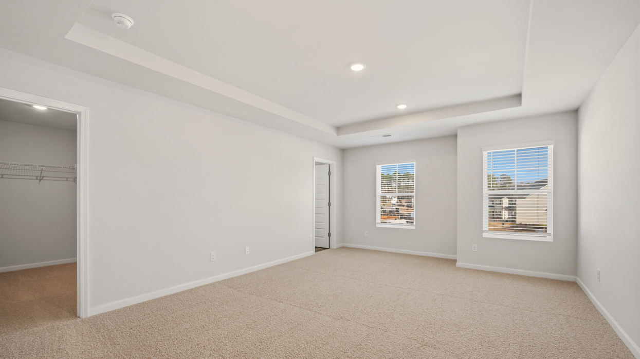 bedroom 1 with tray ceiling