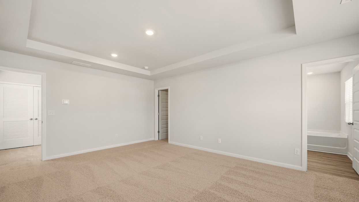 bedroom 1 with tray celing
