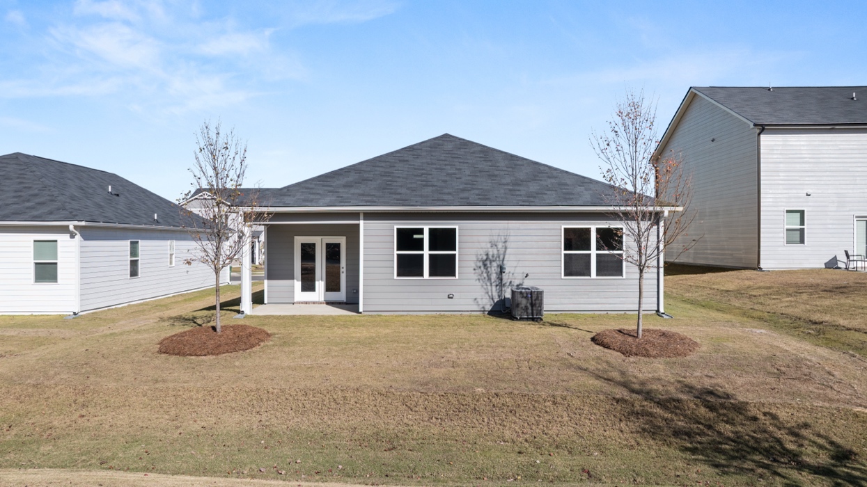 back exterior ranch plan covered patio yard