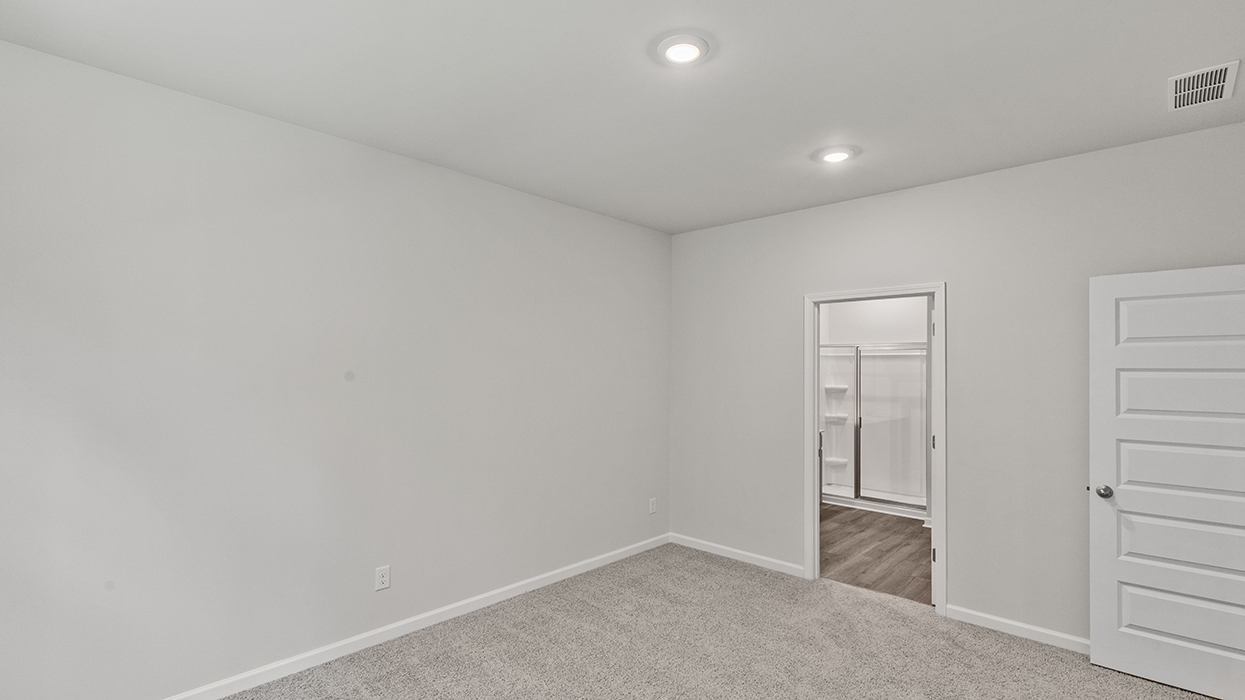 primary bedroom with access to primary bathroom