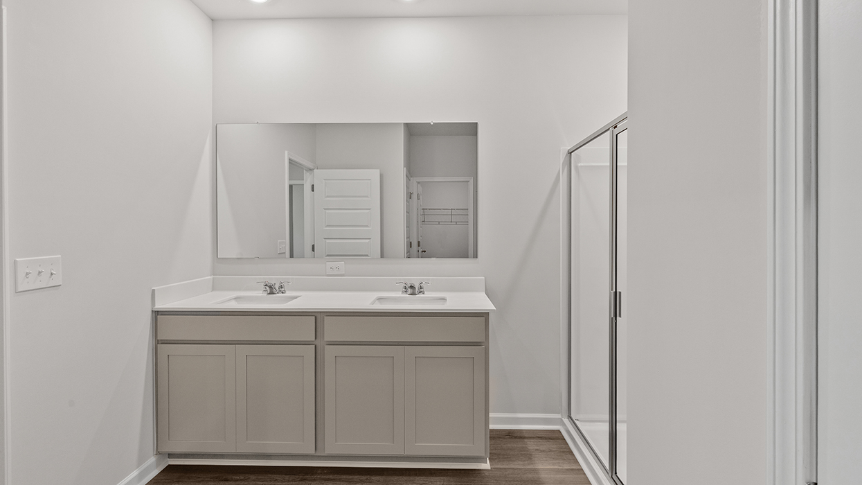 primary bathroom with dual sinks