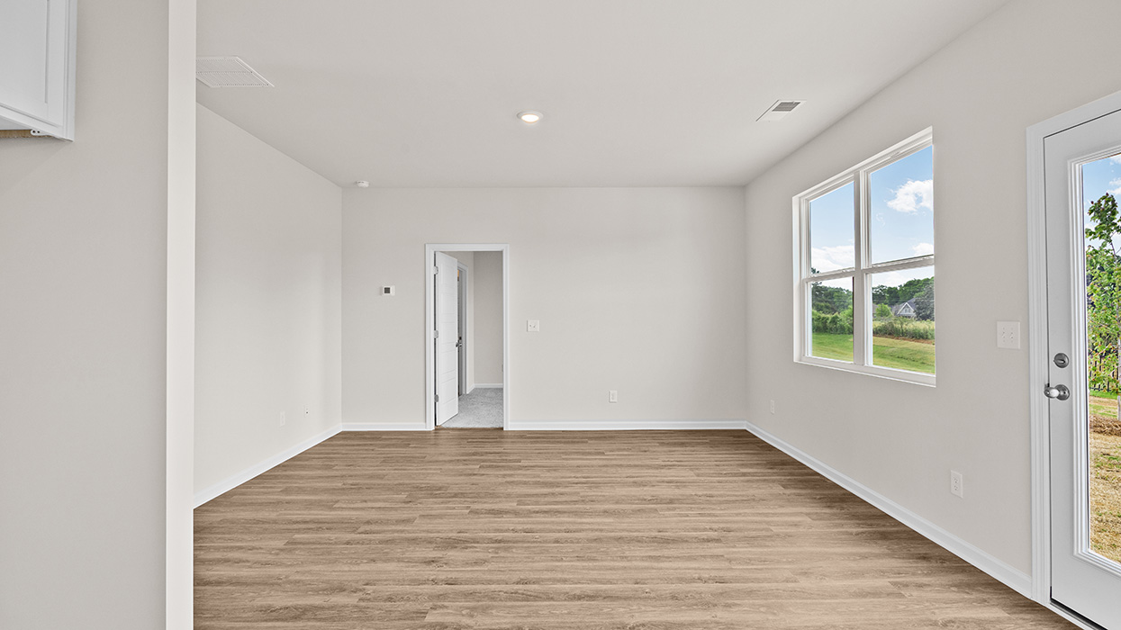 living room with natural light and rear patio access