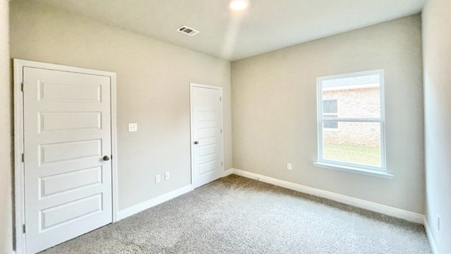 Guest bedroom with ample space for furniture in Mobile.
