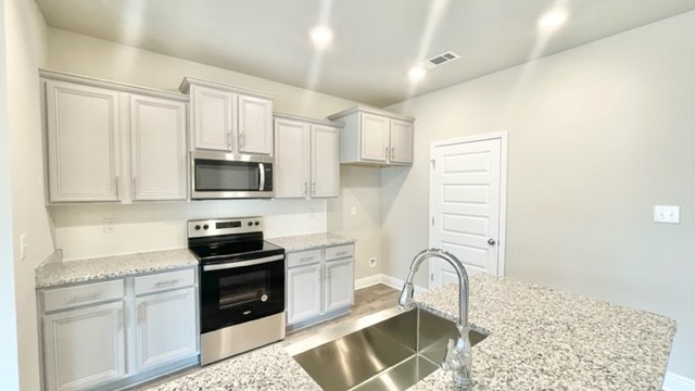 Kitchen cabinets in a new DR Horton home.