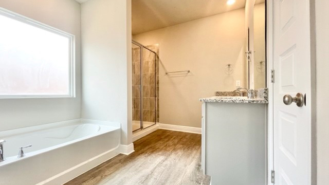 Primary bath with soaking tub and separate tub.