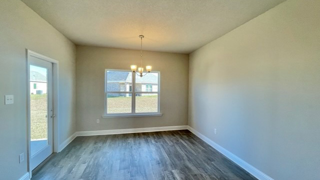 Dining room with window and patio door to covered porch.