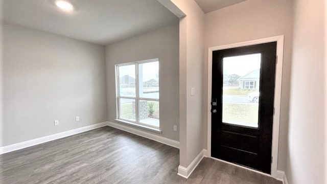 The entry to the home with flexible space that can be used as dining room or study.