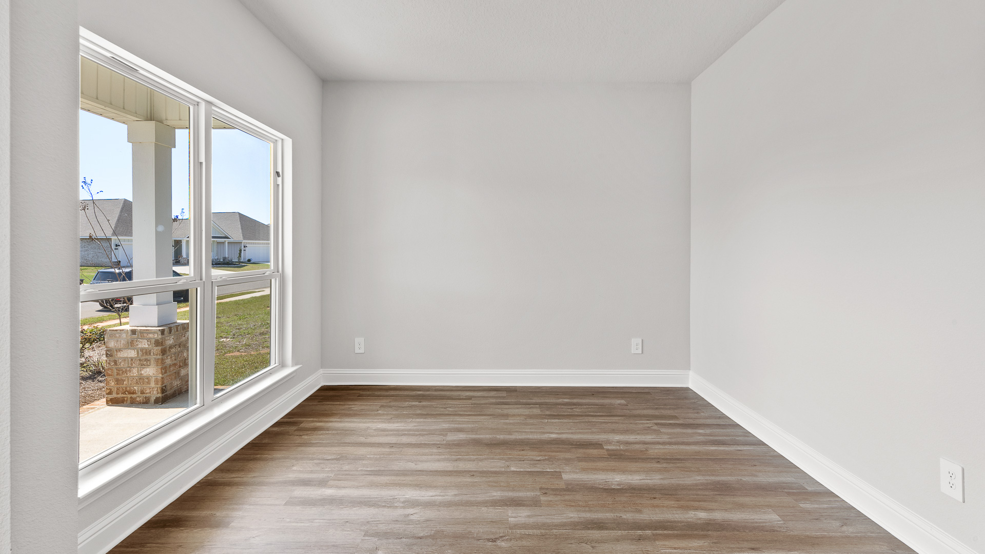 Dining room in The Oakley floorplan with LVP flooring.