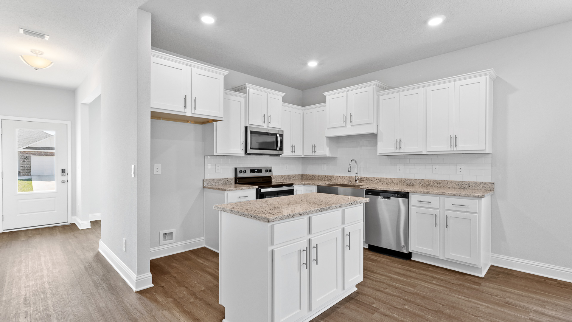 Dreamy white kitchen with granite countertops for sale in Mobile.