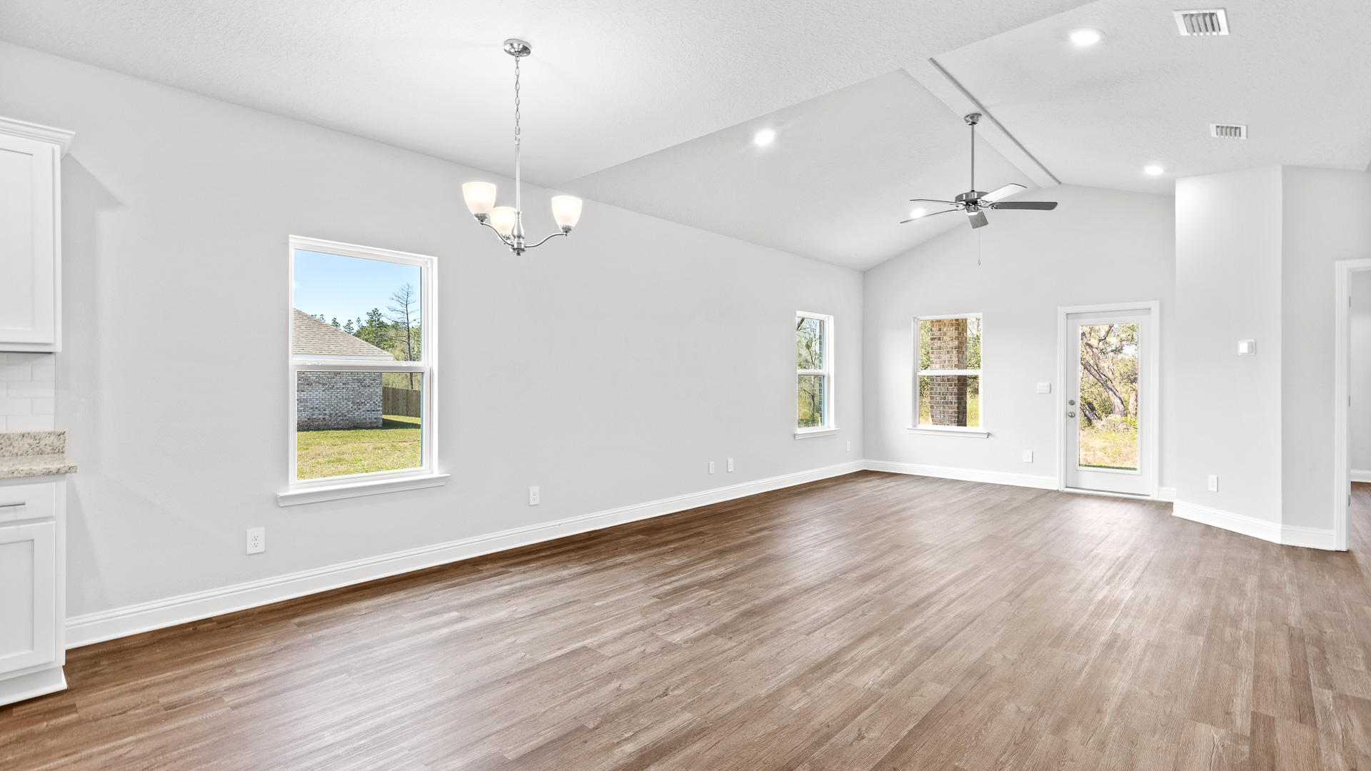 Open concept living space with luxury vinyl plank and lots of natural light.