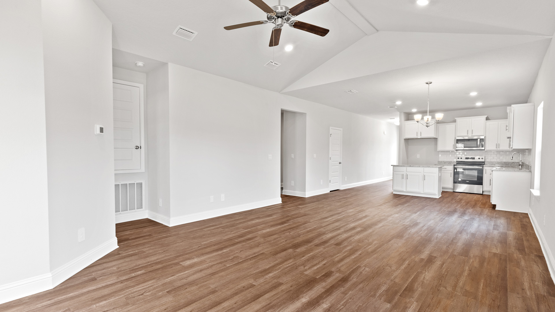 High ceilings in a new home with a white kitchen in Mobile, Al.