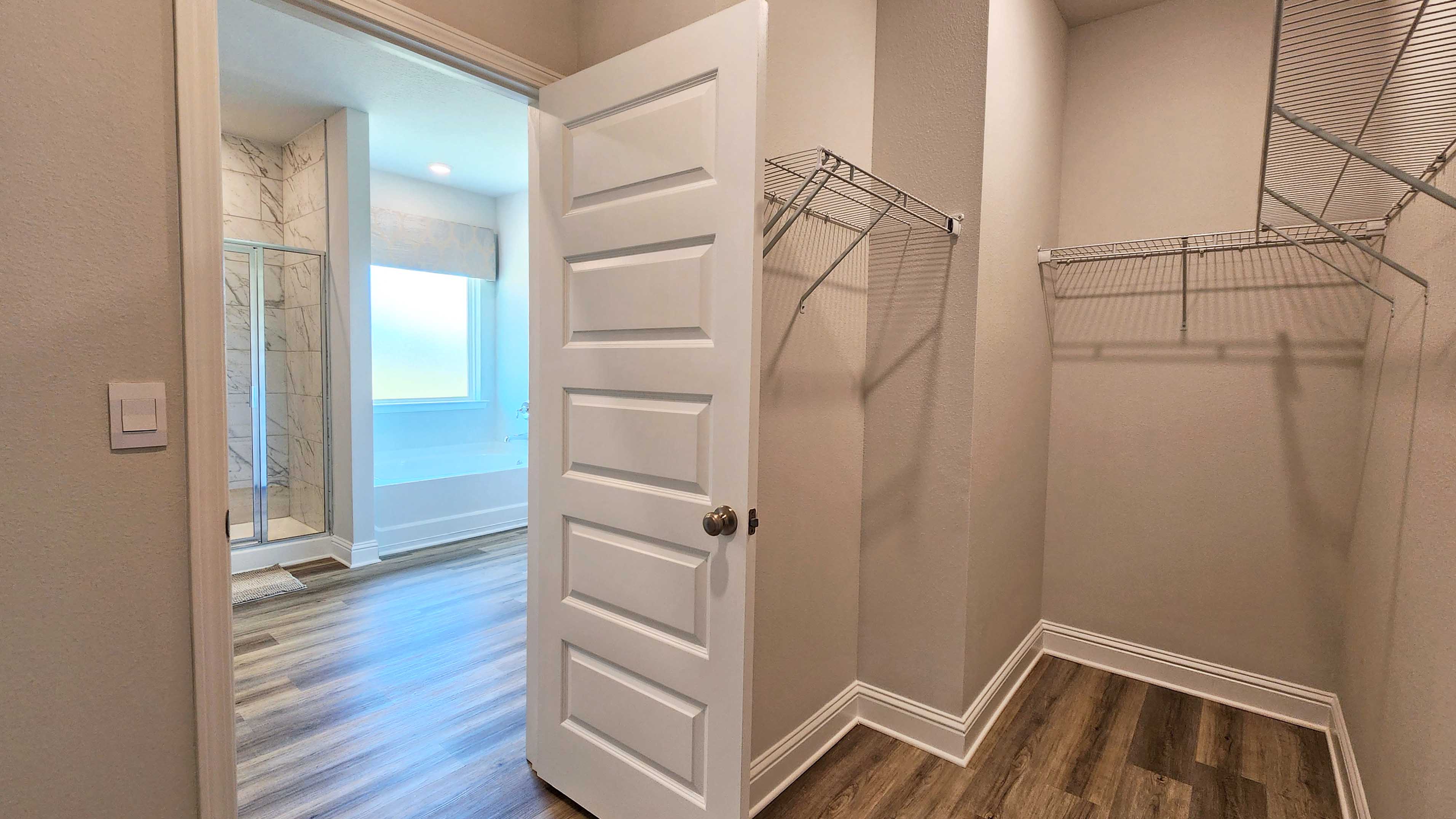 Primary walk-in closet.