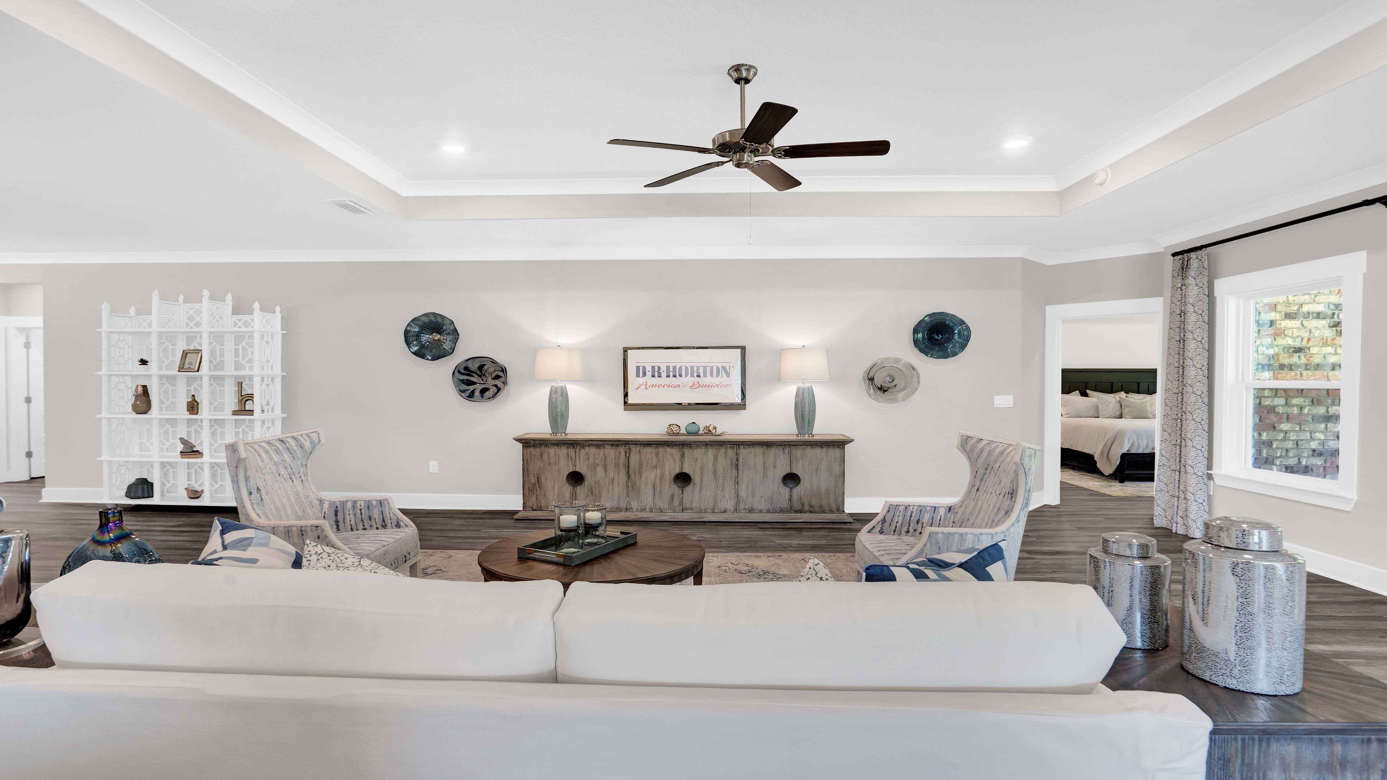 A tray ceiliing in this comfortable living brings the elegance.