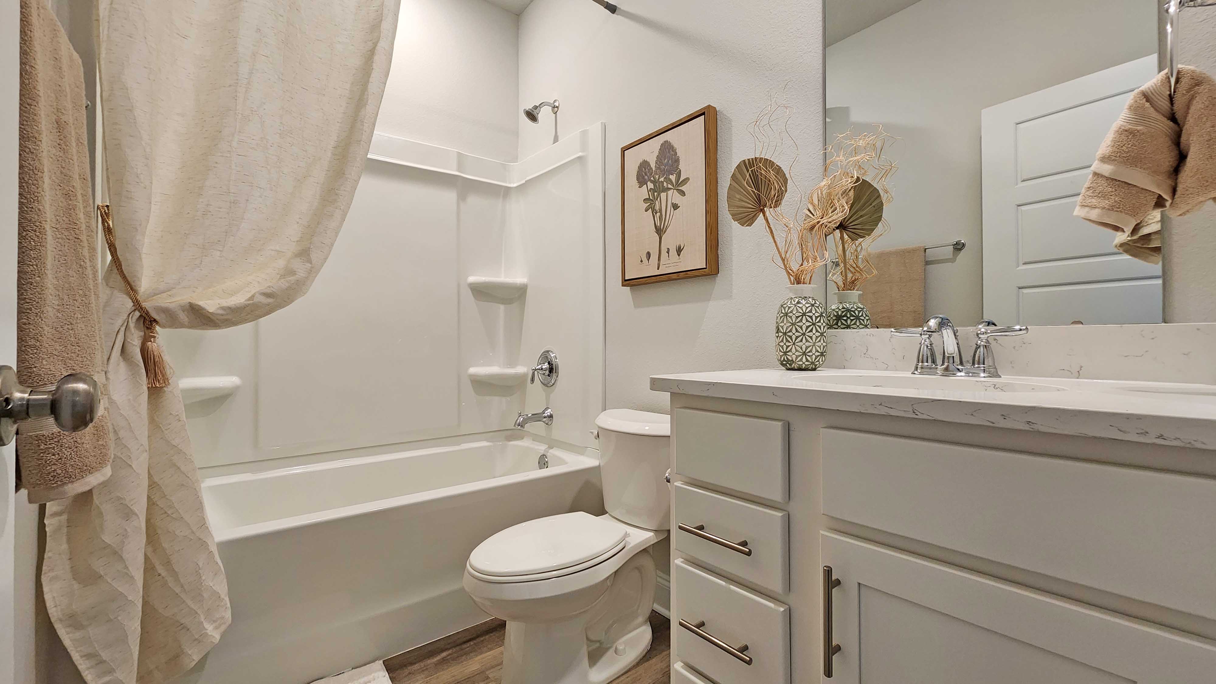 Guest bathroom with shower/tub combination.