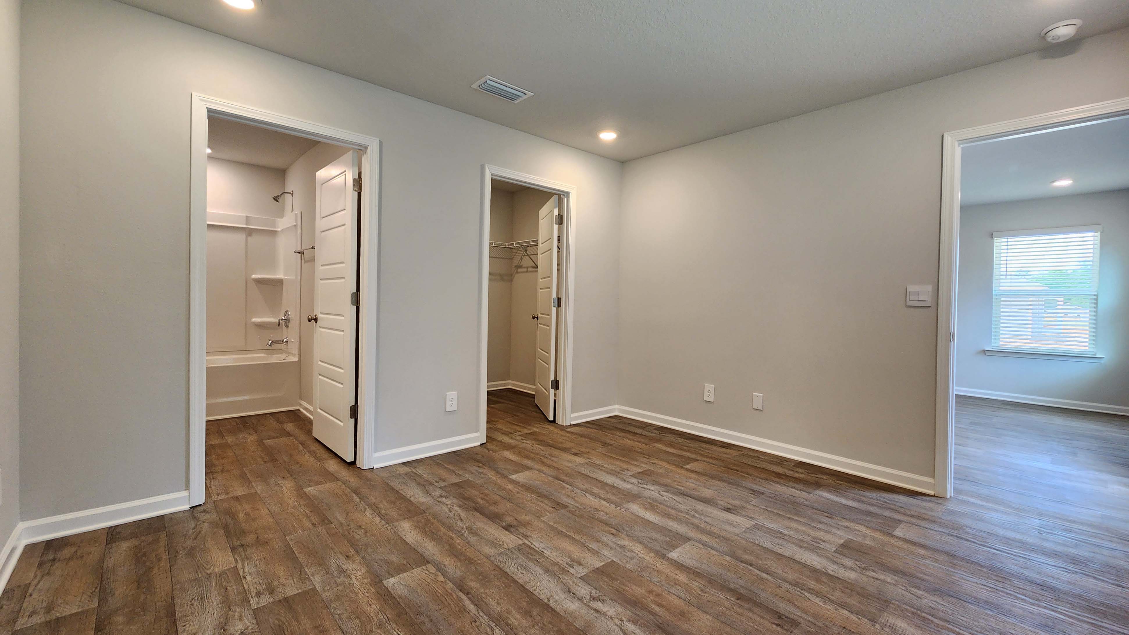 The Sullivan primary bedroom with access to ensuite.