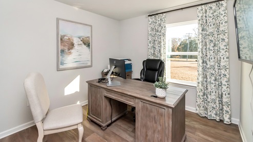 Office room set up inside an additional bedroom.