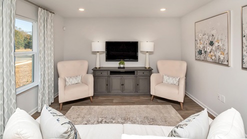 Furniture set up inside the living area that offers plenty of walk and sitting room.