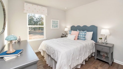 Additional bedroom set up with blue accents inside the Callaway.