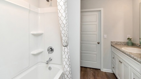 Side view of shower set up inside the bathroom.