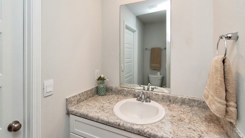 Sink space inside the additional bathroom.