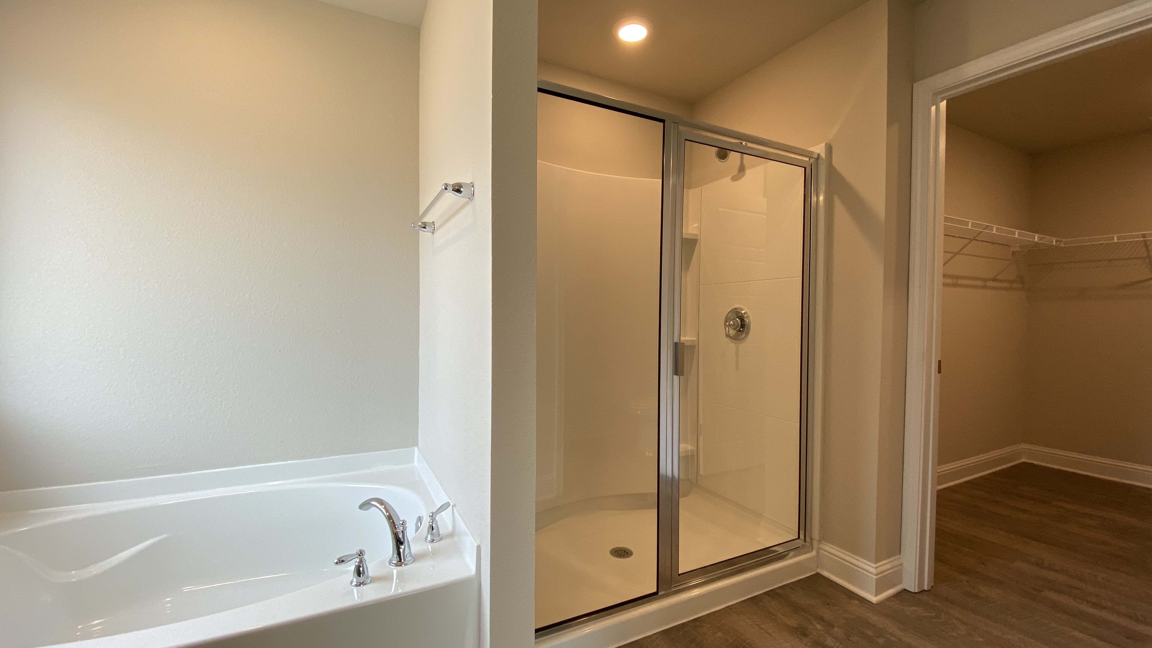 Bright and airy primary bathroom suite