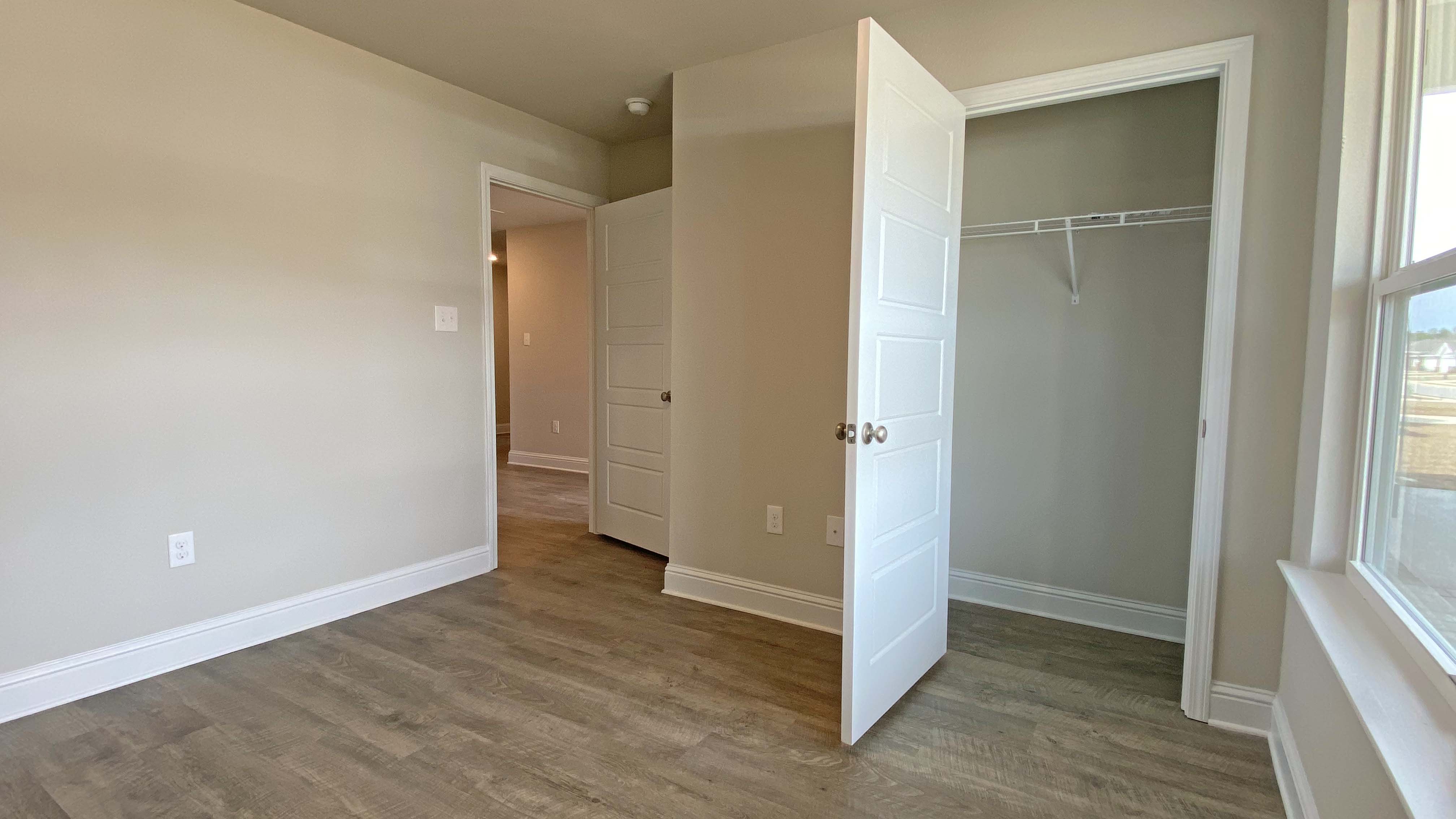Bright and spacious closet inside the additional bedroom
