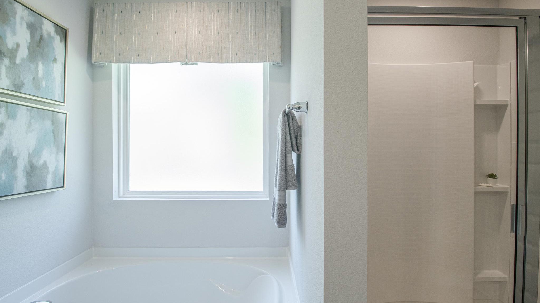 Primary ensuite with garden tub and standing shower.