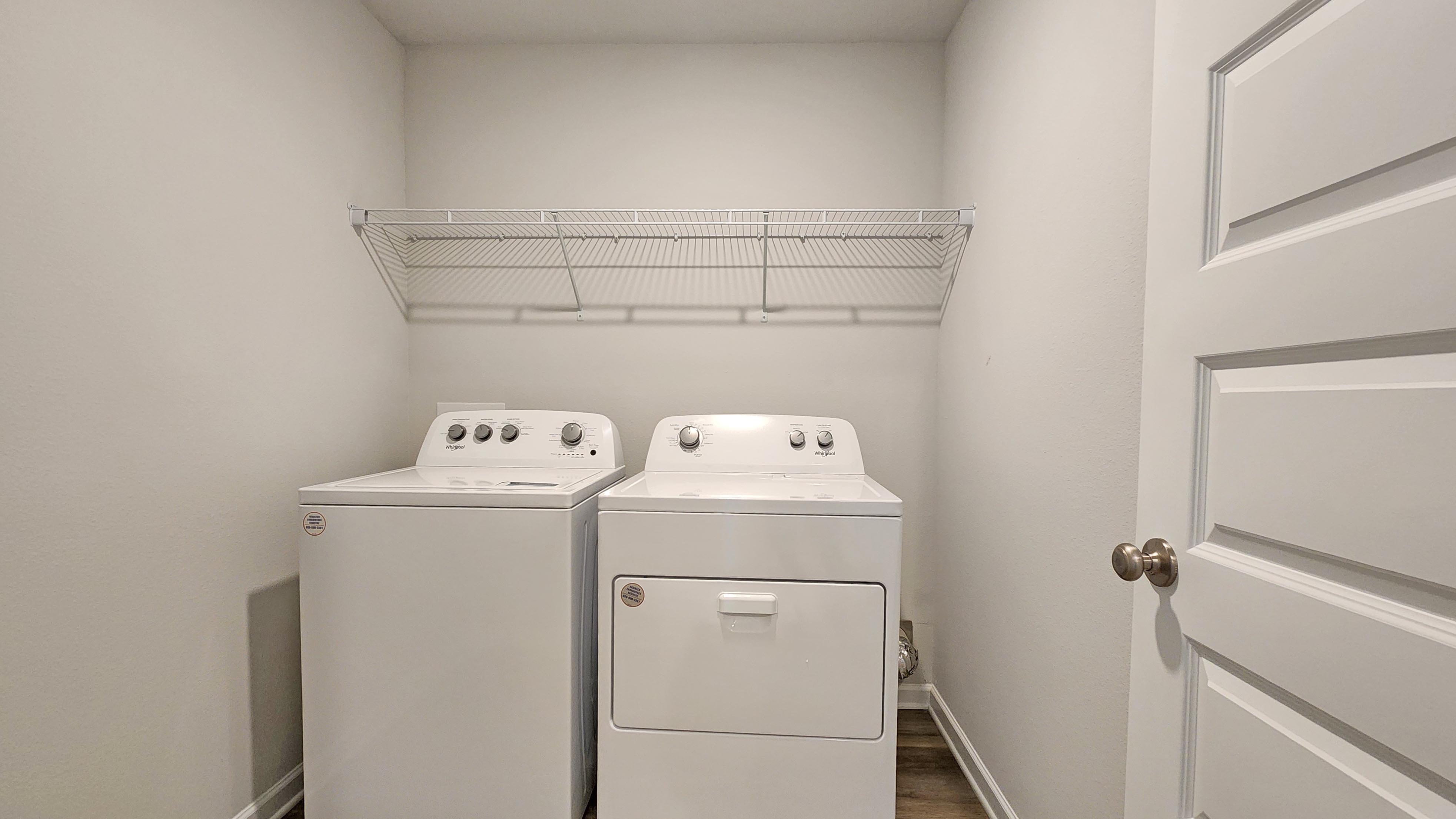 Spacious laundry room inside the Denton