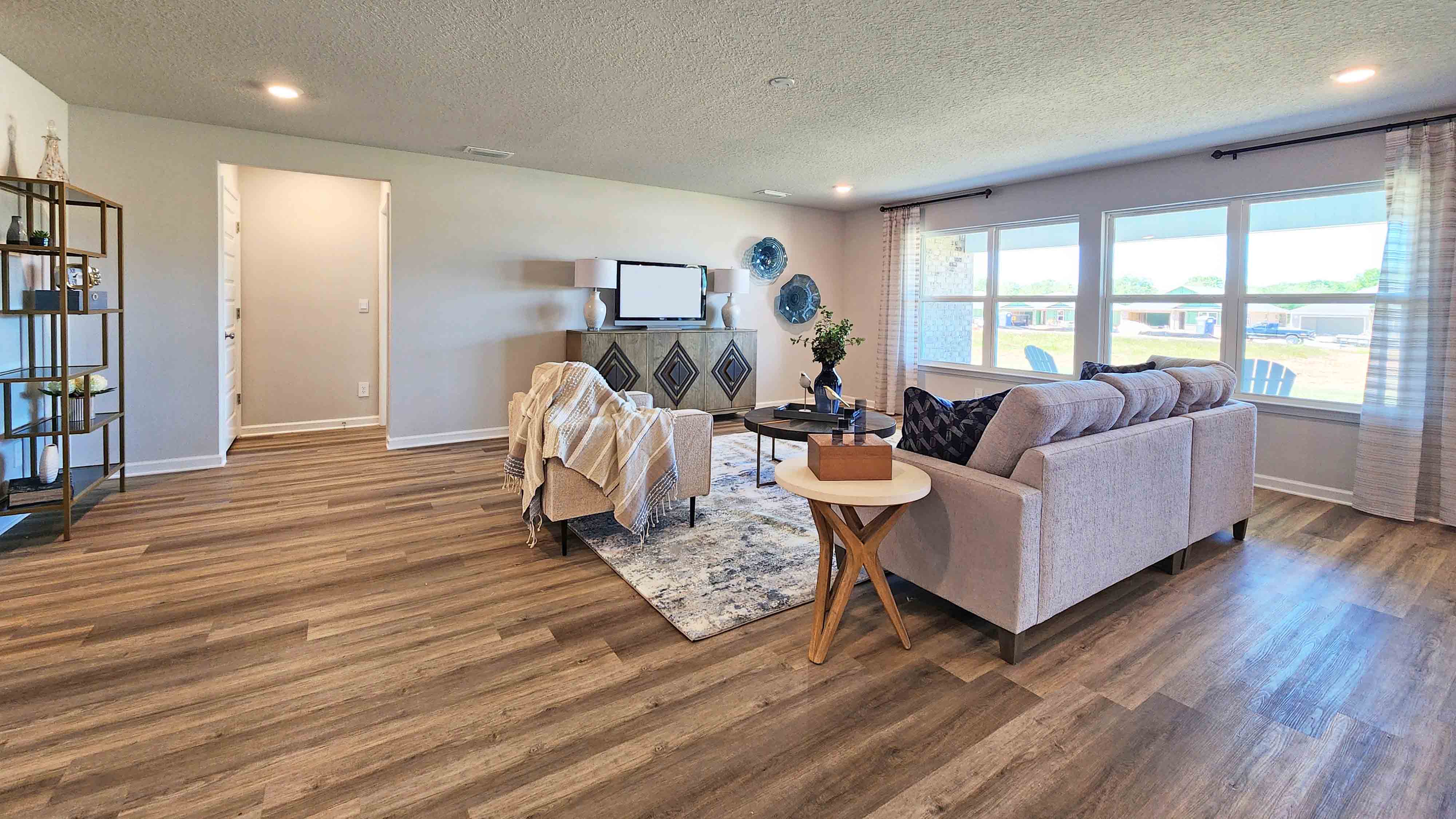 The Denton living area with open concept living including kitchen and dining room.